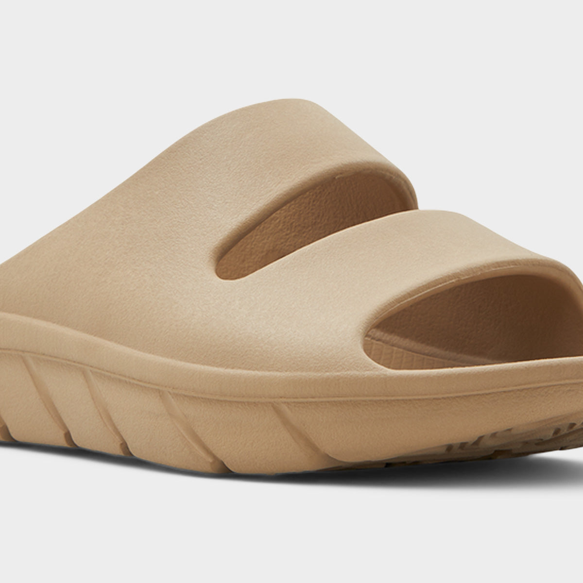 Close-up of beige slide sandal