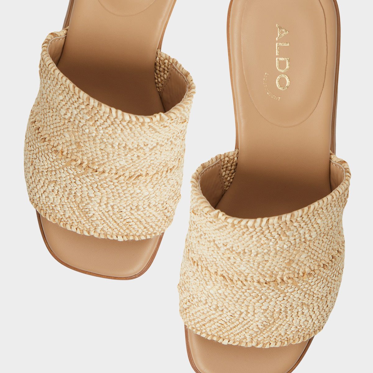 Pair of woven sandals with 'ALDO' branding on a light gray background
