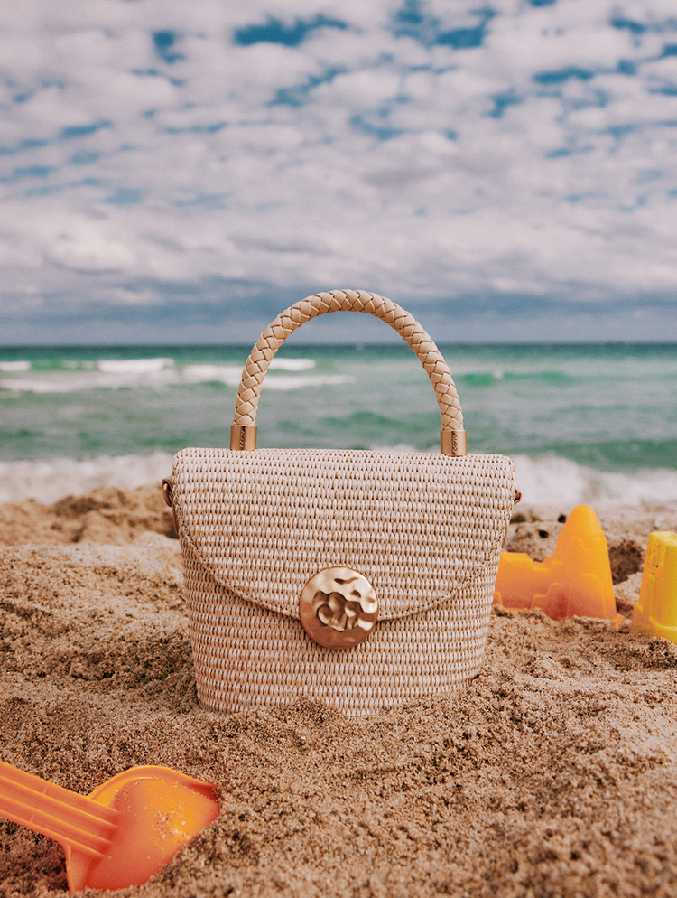raffia handbag on the sand
