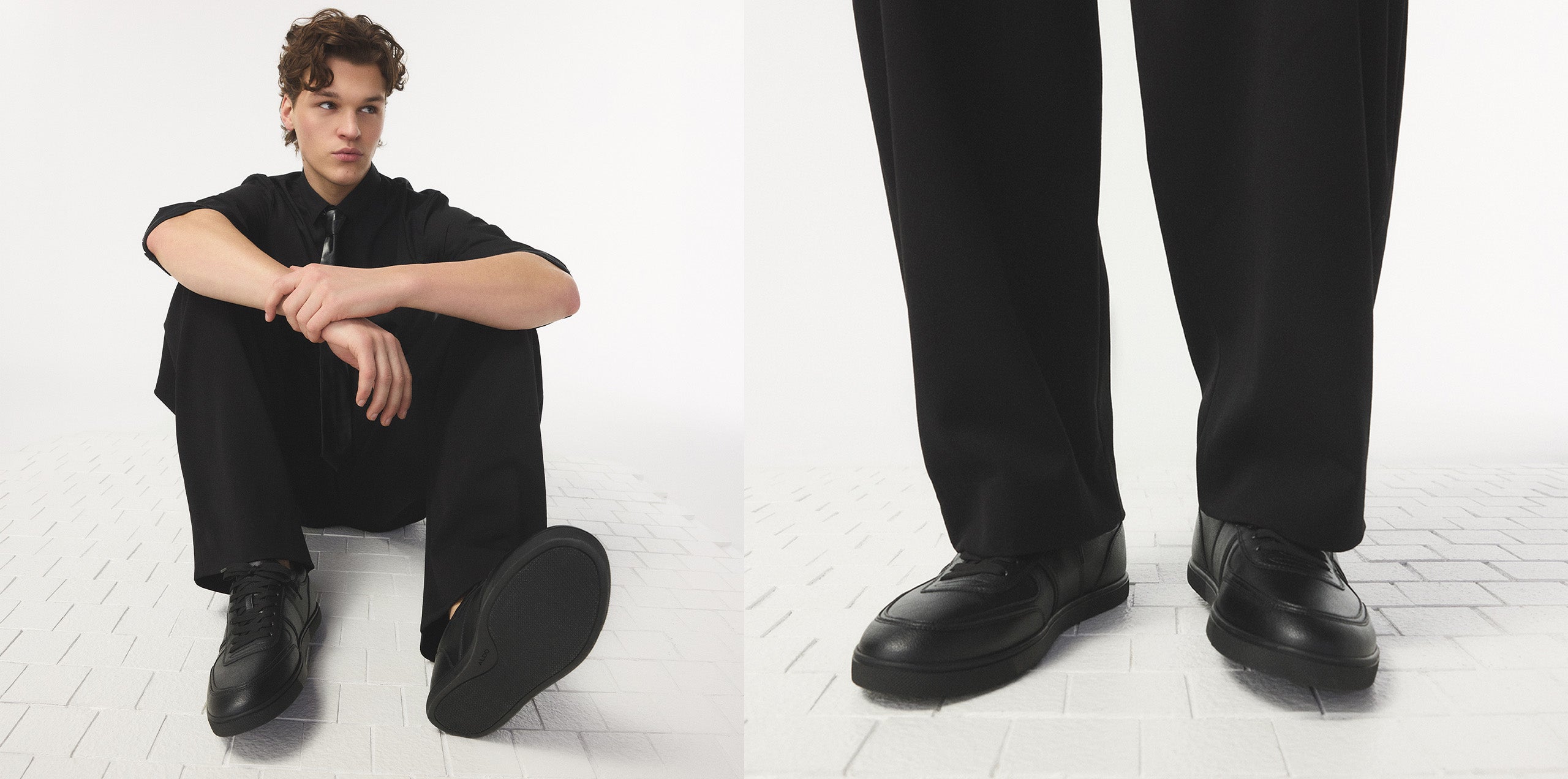 Person wearing black shoes and pants sitting on a white floor, with close-up of shoes shown.