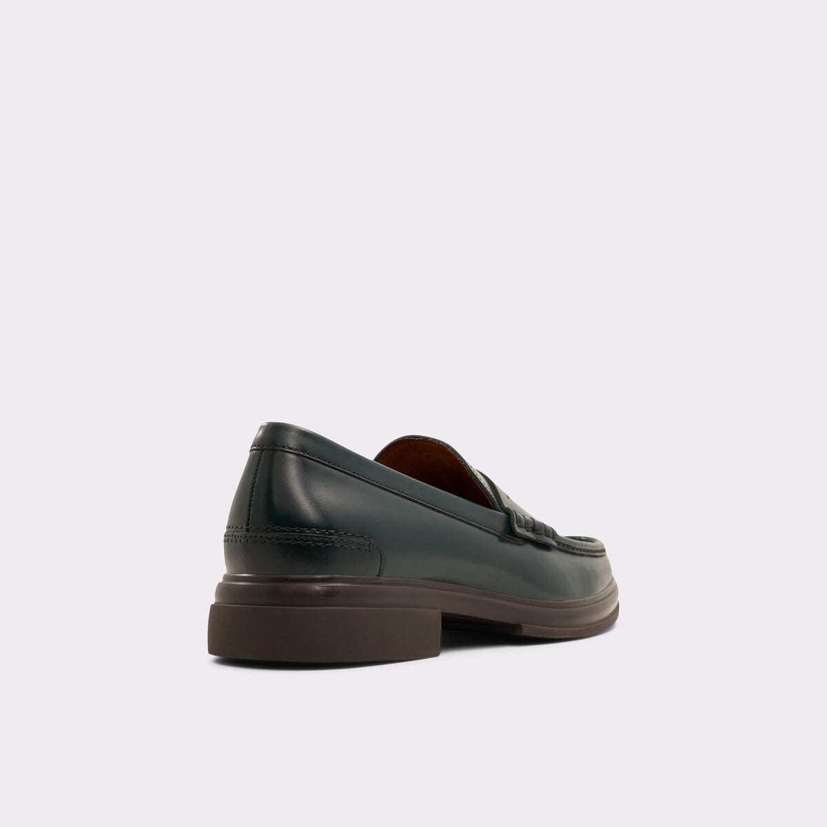 Three-quarter angle of Dark Green Tucker Loafer's back side