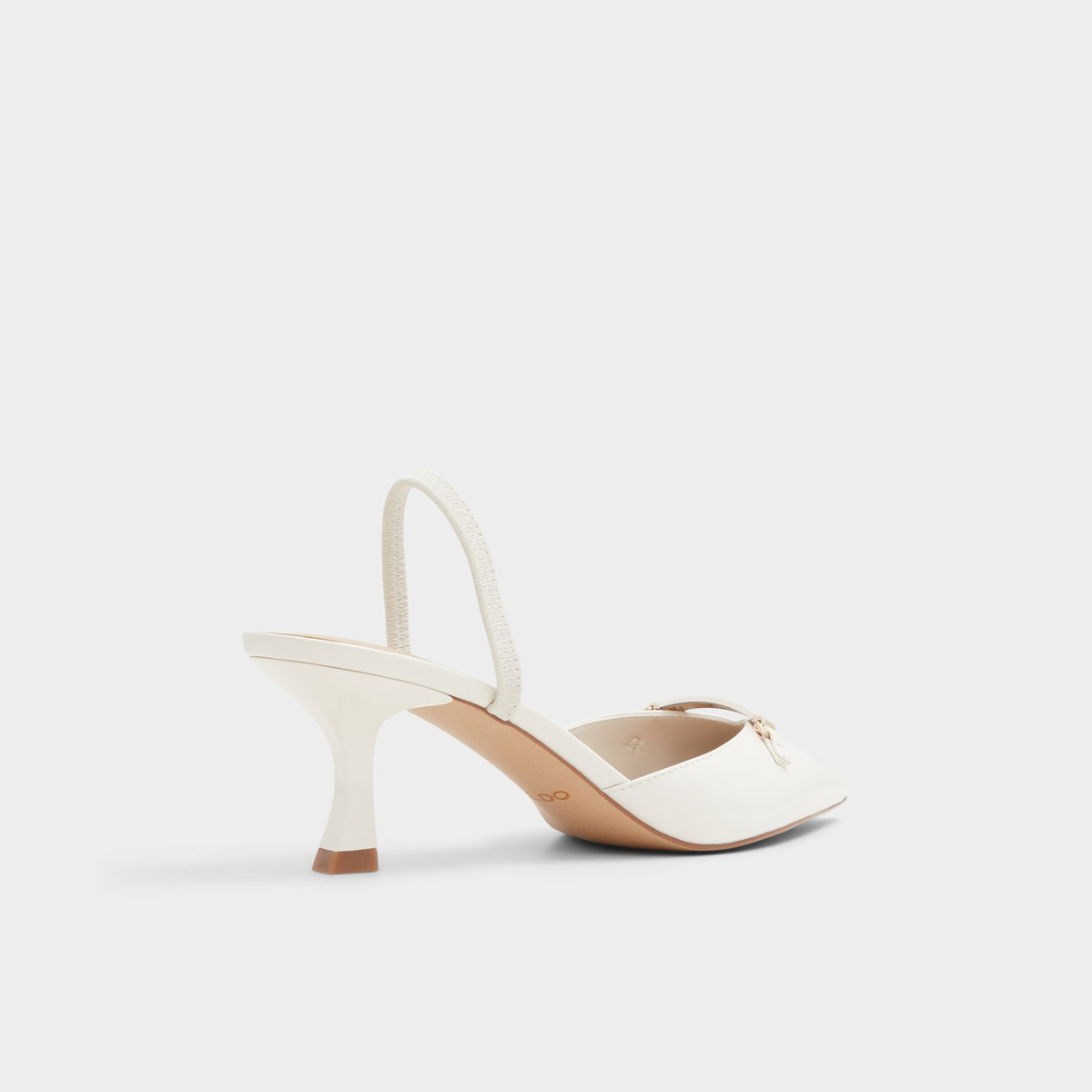 Three-quarter angle of White/bone Nailah Slingback kitten heel's back side