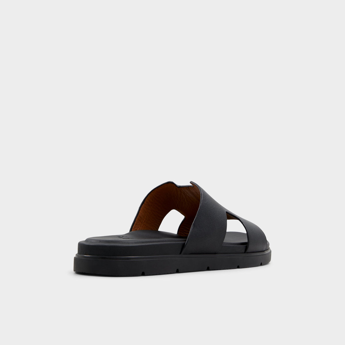 Three-quarter angle of Black Chano Slide sandal's back side