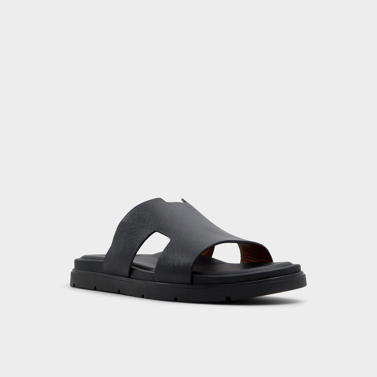 Three-quarter angle of Black Chano Slide sandal's front side
