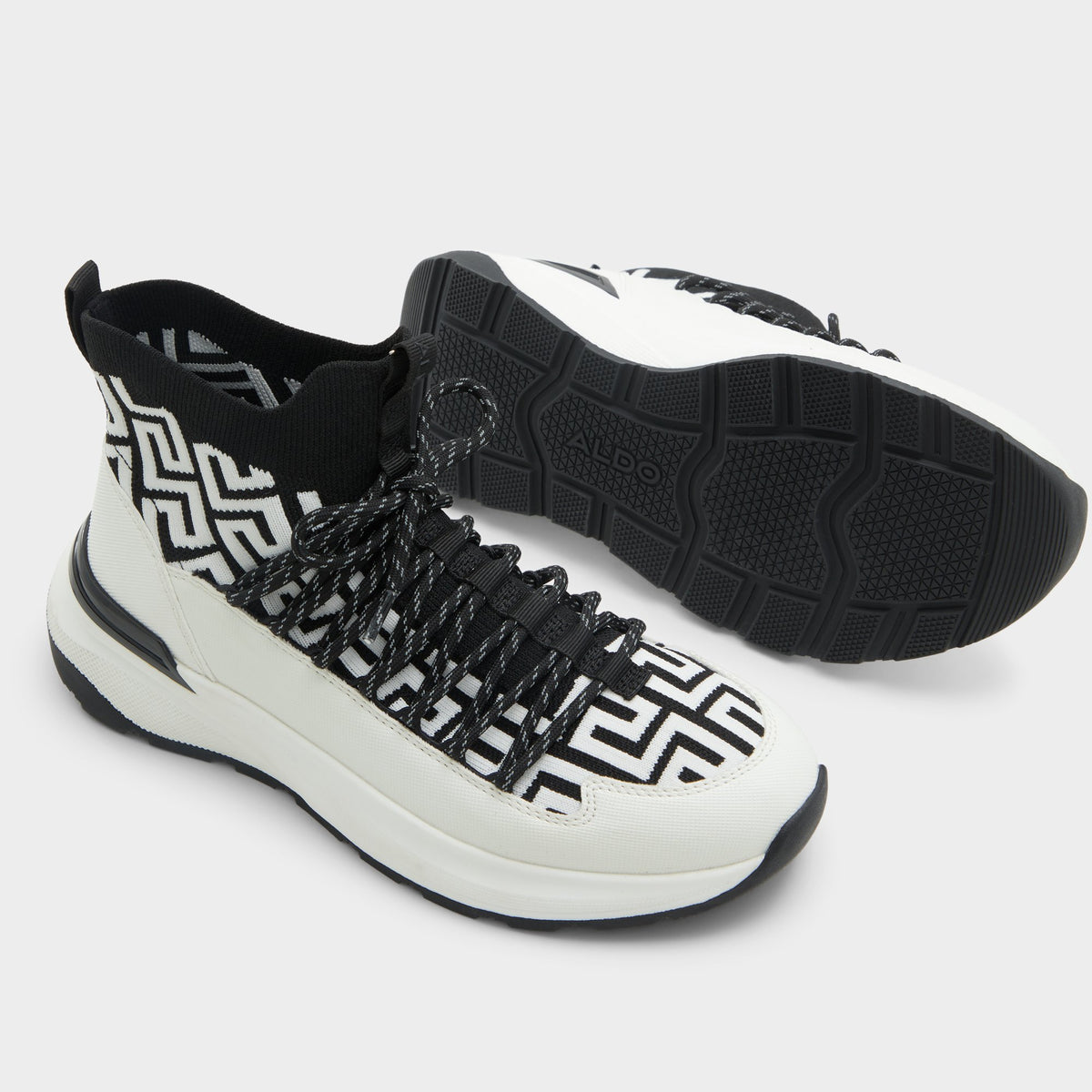 Highlighted view of a pair of White/Black Everlynn Jogger sneakers