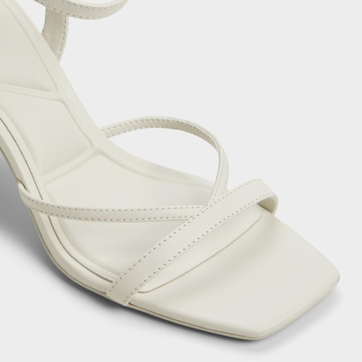 Close-up of the White/bone Stellare Strappy heeled sandal