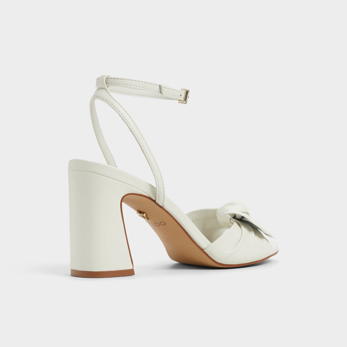 Three-quarter angle of White/bone Angelknot Strappy heeled sandal's back side