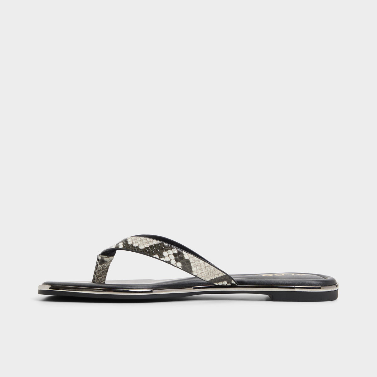 Side view of White/black Theao Flip flop