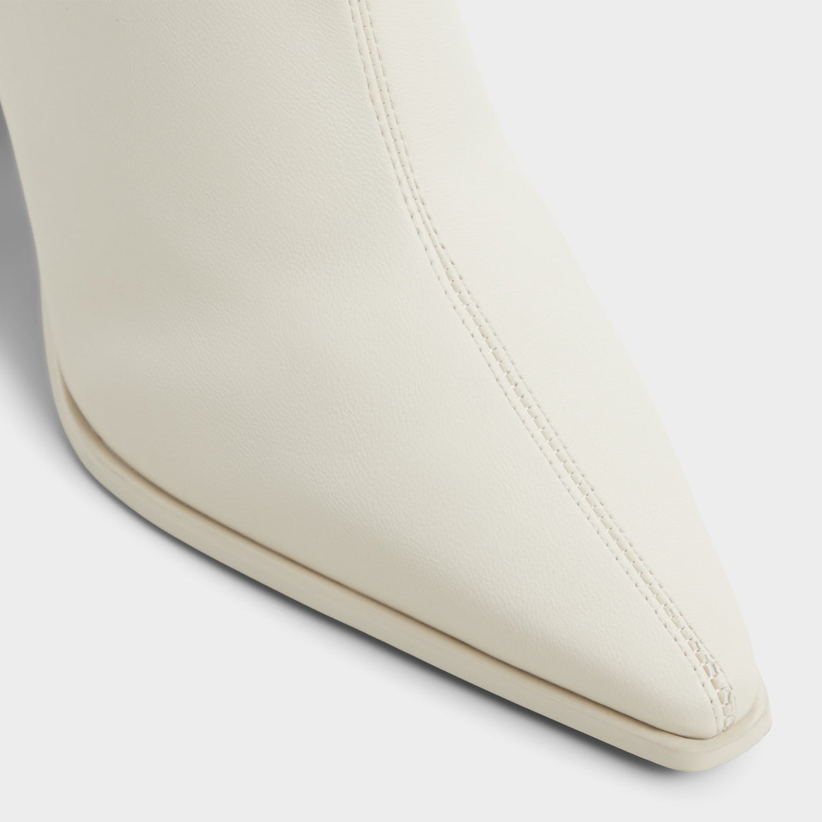Close-up of the White/bone Figgy Block heel ankle boot