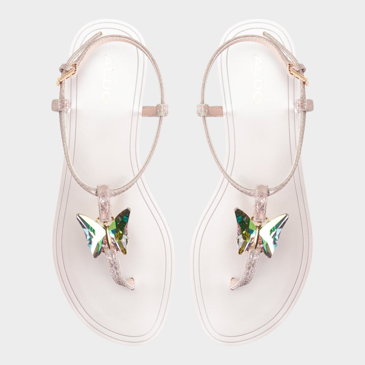 Top-down view of the Rose gold Farfallina T-strap sandal
