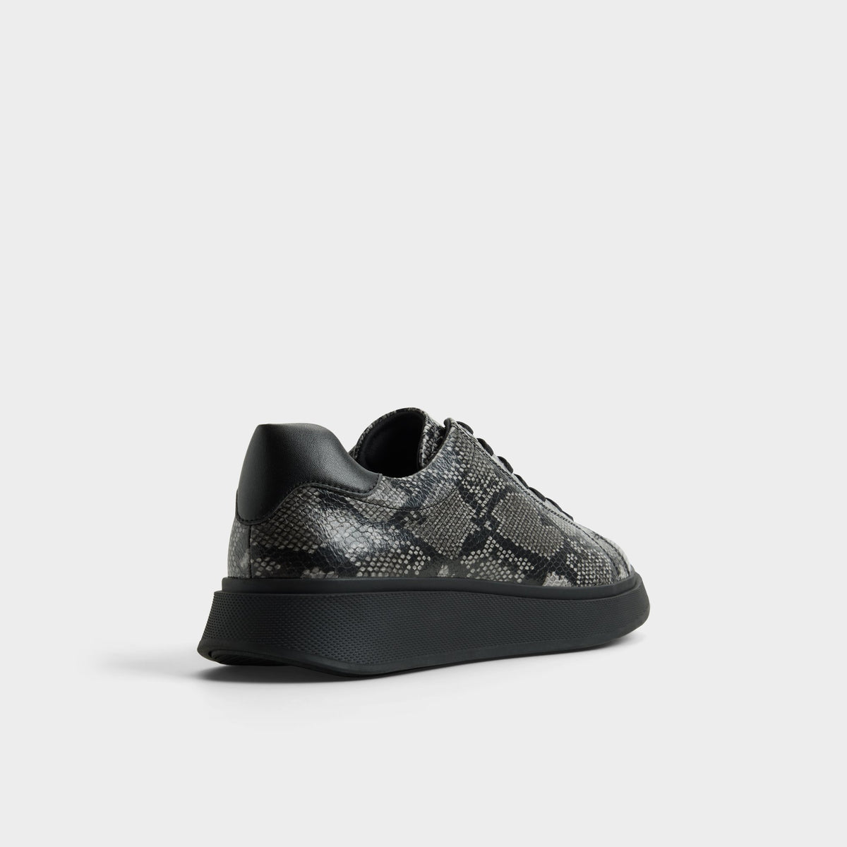 Three-quarter angle of Black combo Magnus Low top sneaker's back side