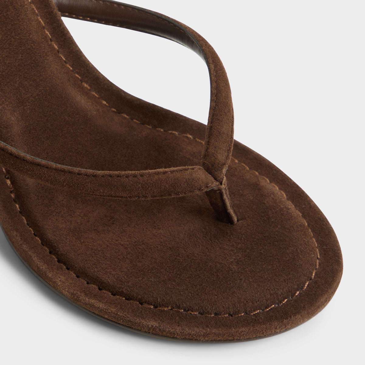 Close-up of the Dark brown Skipp Heeled flip flop