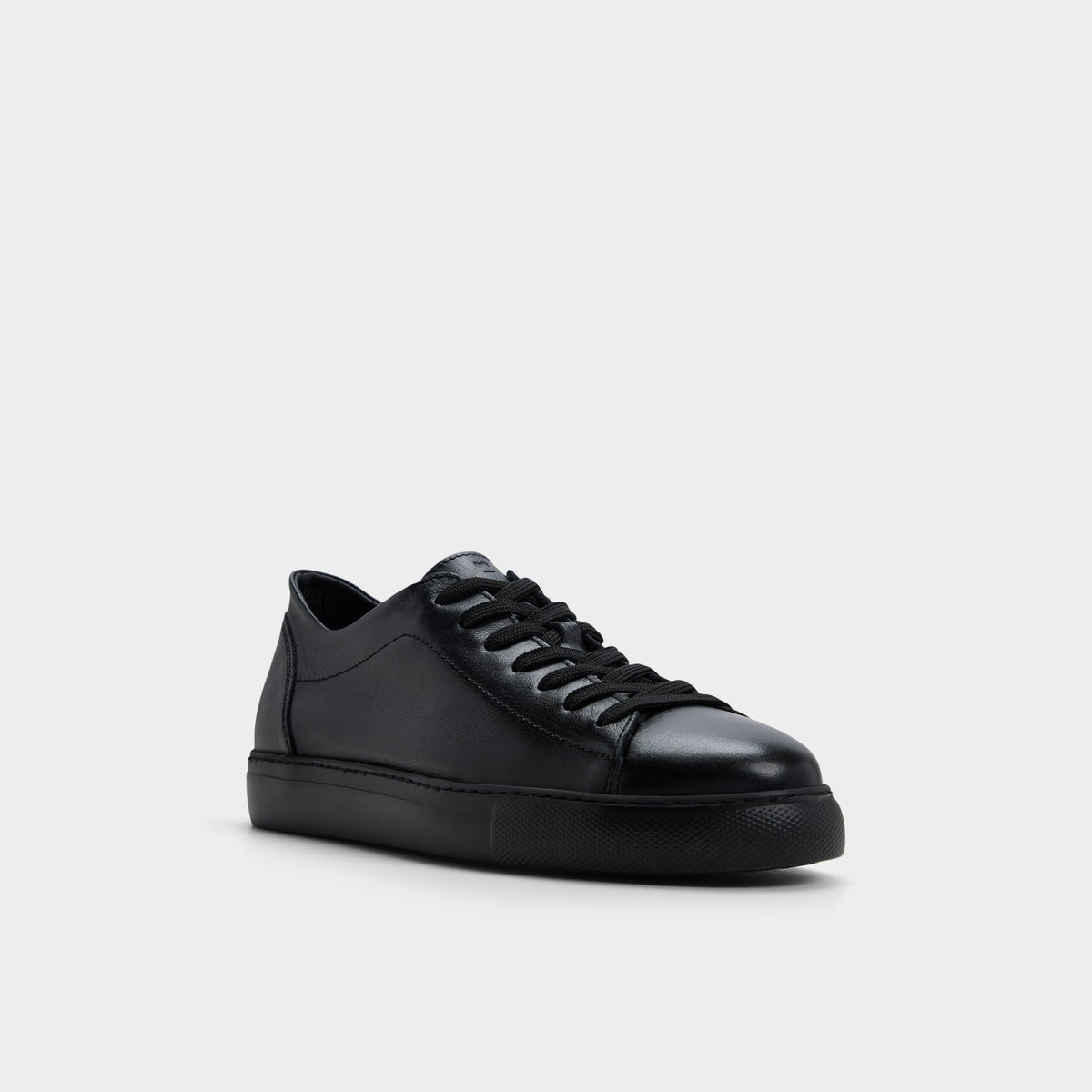 Three-quarter angle of Black Hawke Low top sneaker's front side