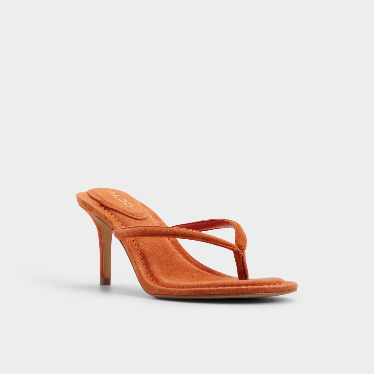 Three-quarter angle of Dark orange Skipp Heeled thong sandal's front side