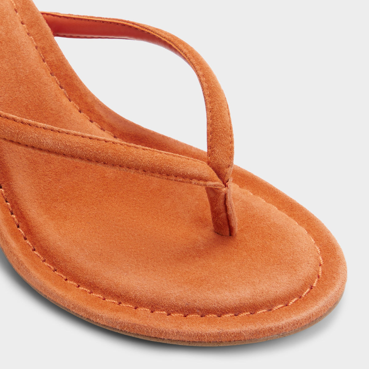 Close-up of the Dark orange Skipp Heeled thong sandal