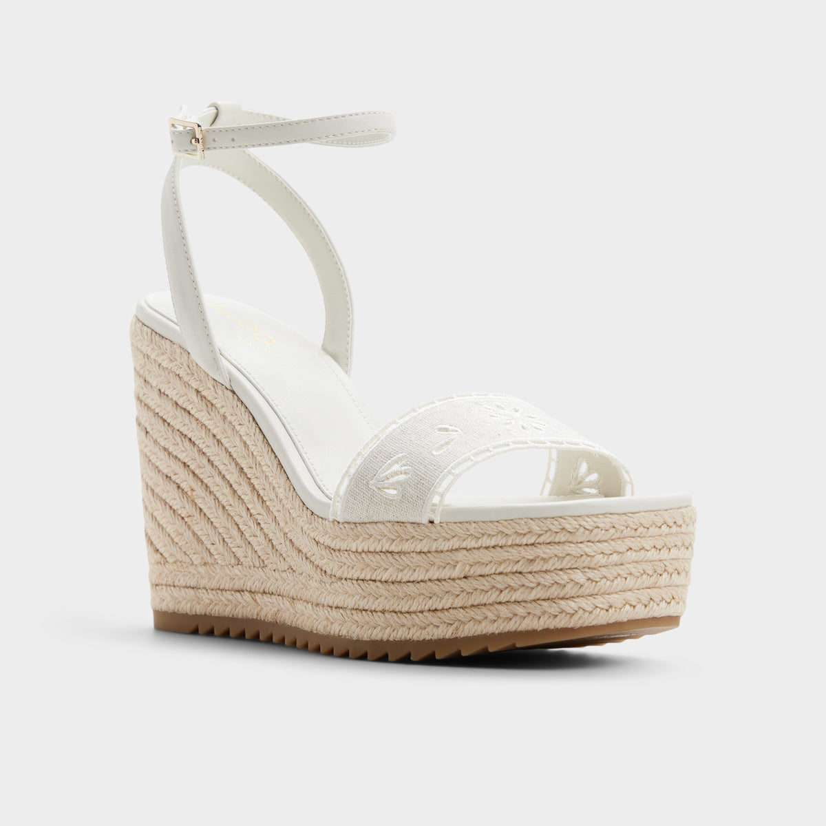 Three-quarter angle of White/bone Aberitram Wedge sandal's front side