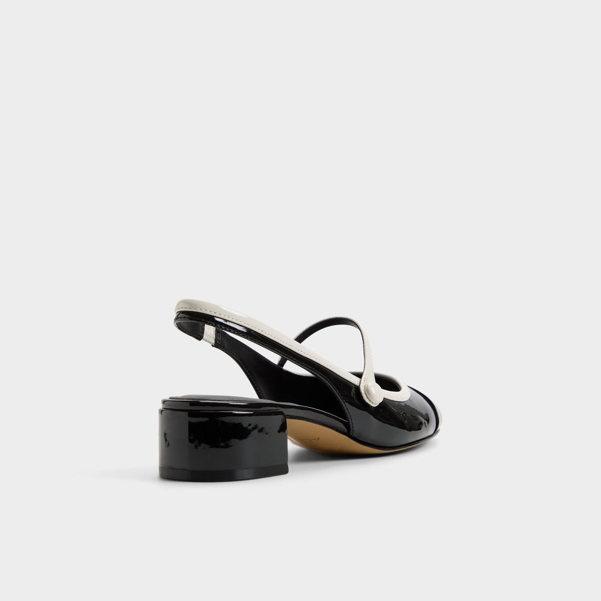 Three-quarter angle of Black/white Aggie High heel shoe's back side