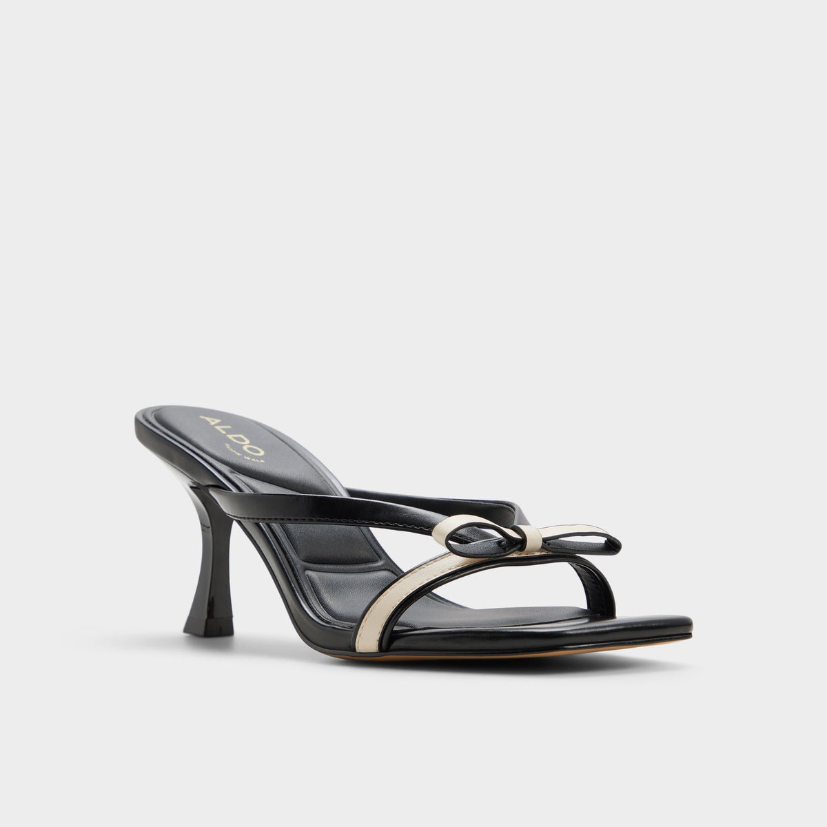 Three-quarter angle of Beige combo Elanore Heeled mule's front side