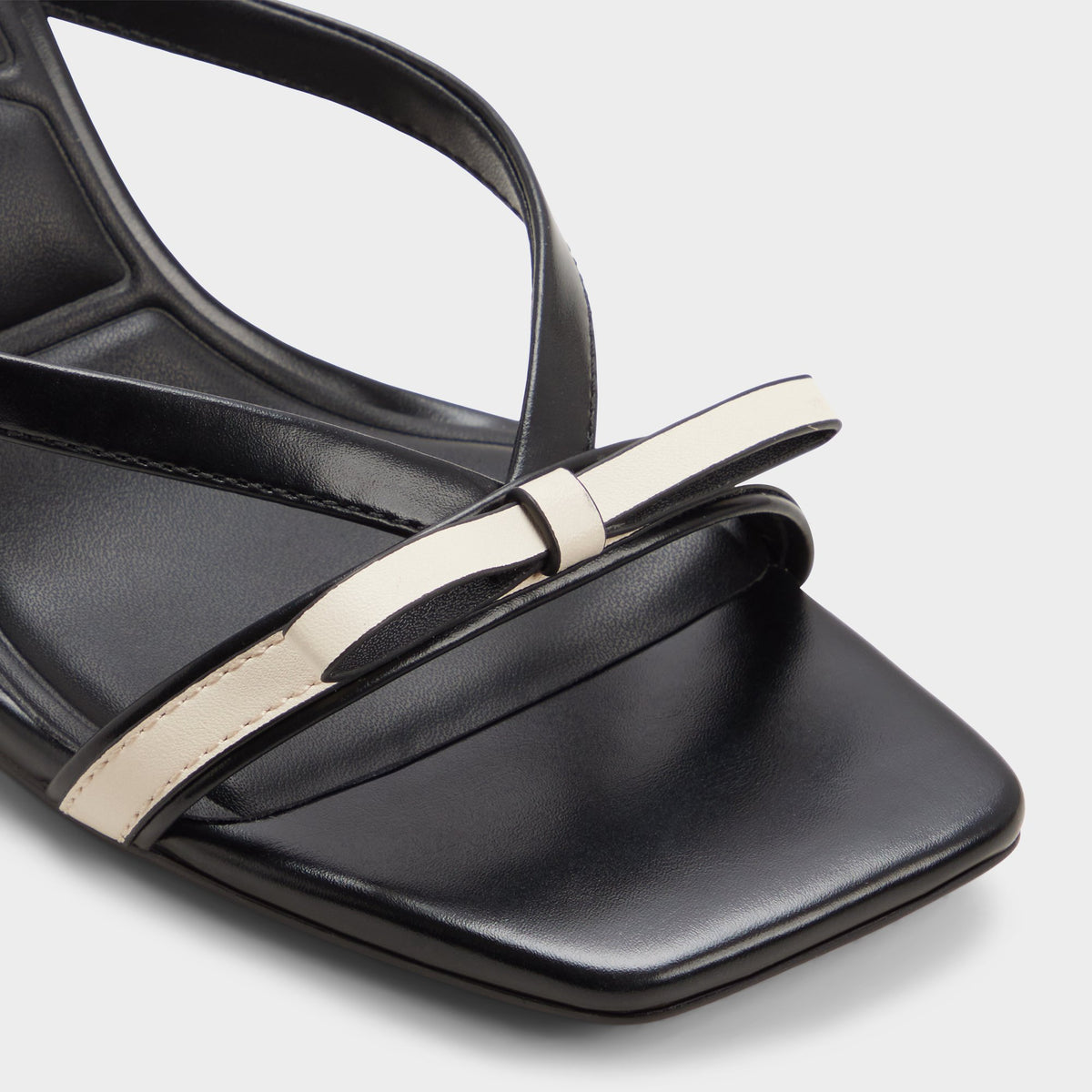 Close-up of the Beige combo Elanore Heeled mule