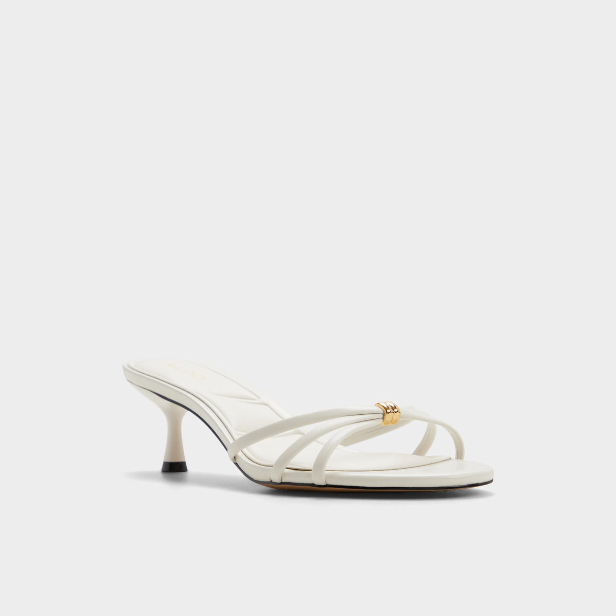 Three-quarter angle of White/bone Madalyn Heeled mule's front side