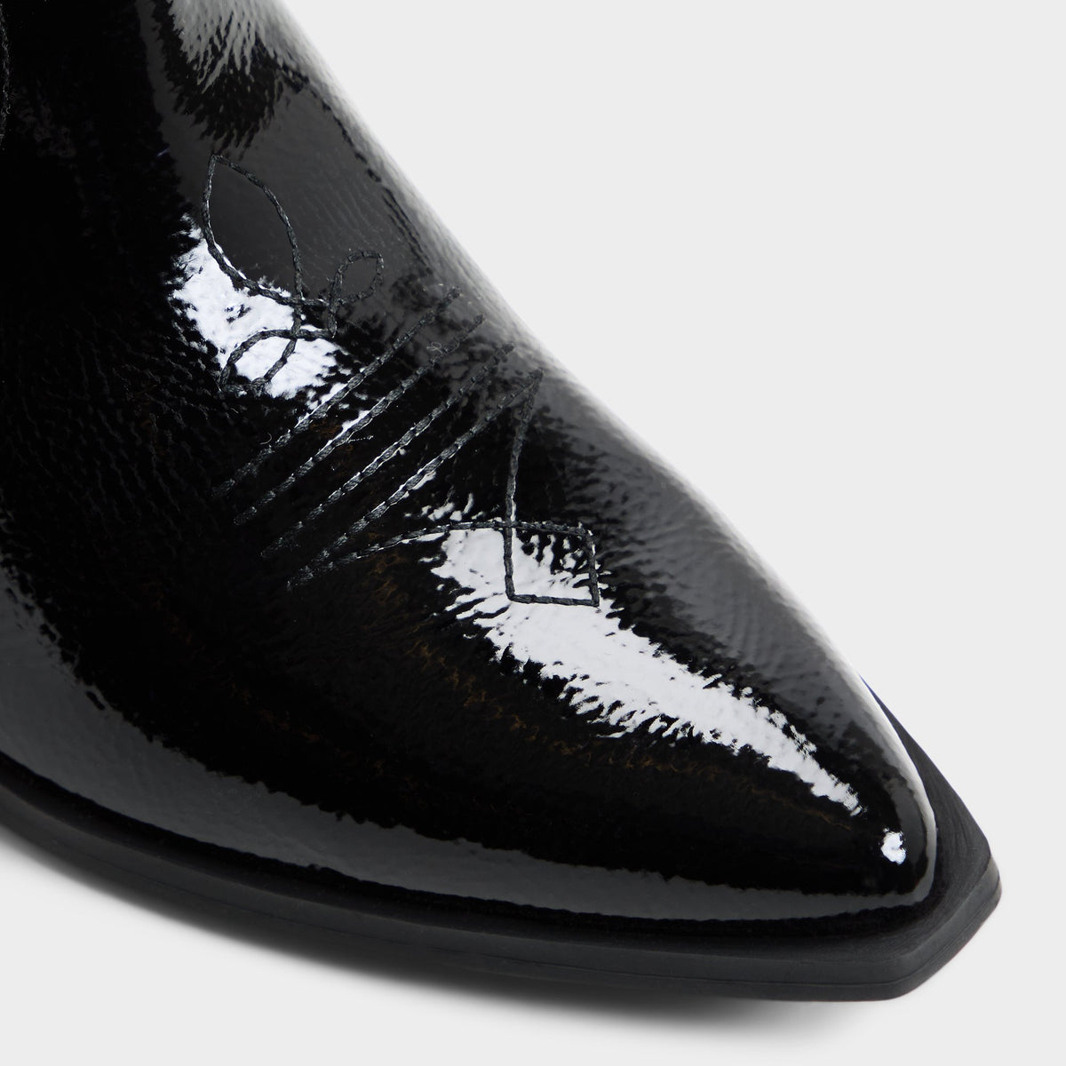 Close-up of the Black combo Cherrily Western knee-high boot