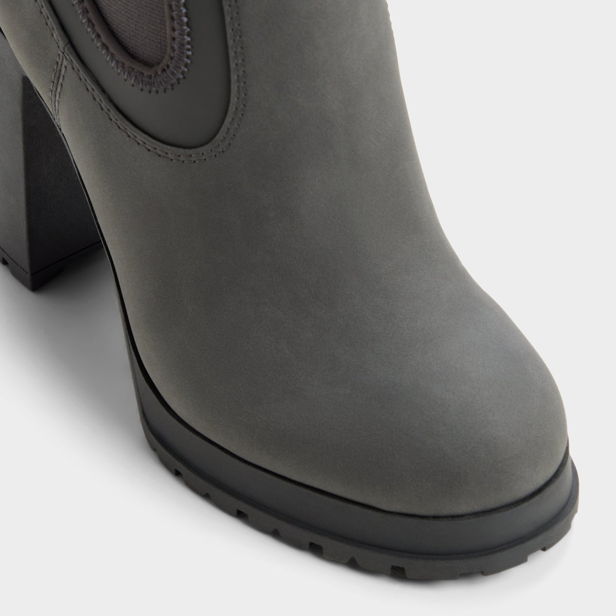 Three-quarter angle of Dark grey Bold Lug sole ankle boot's front side