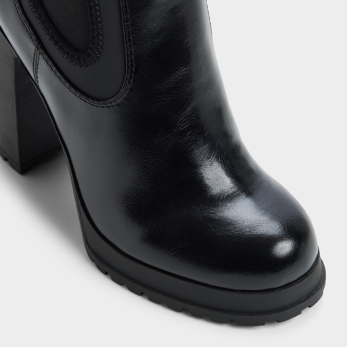 Three-quarter angle of Other black Bold Lug sole ankle boot's front side