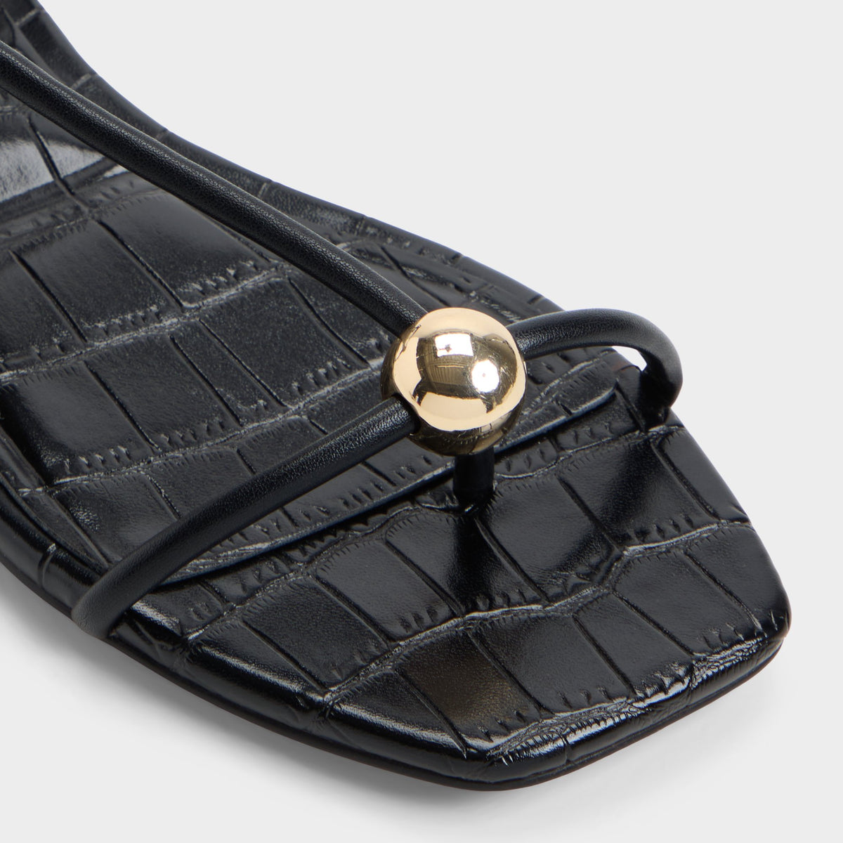 Close-up of the Black Zaelle Strappy flat sandal