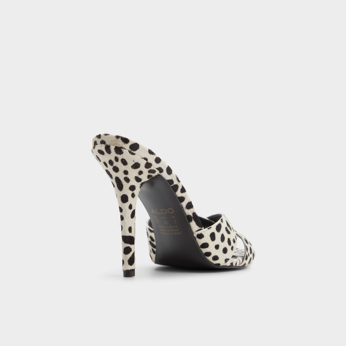 Three-quarter angle of White/black Amandah Heeled mule's back side