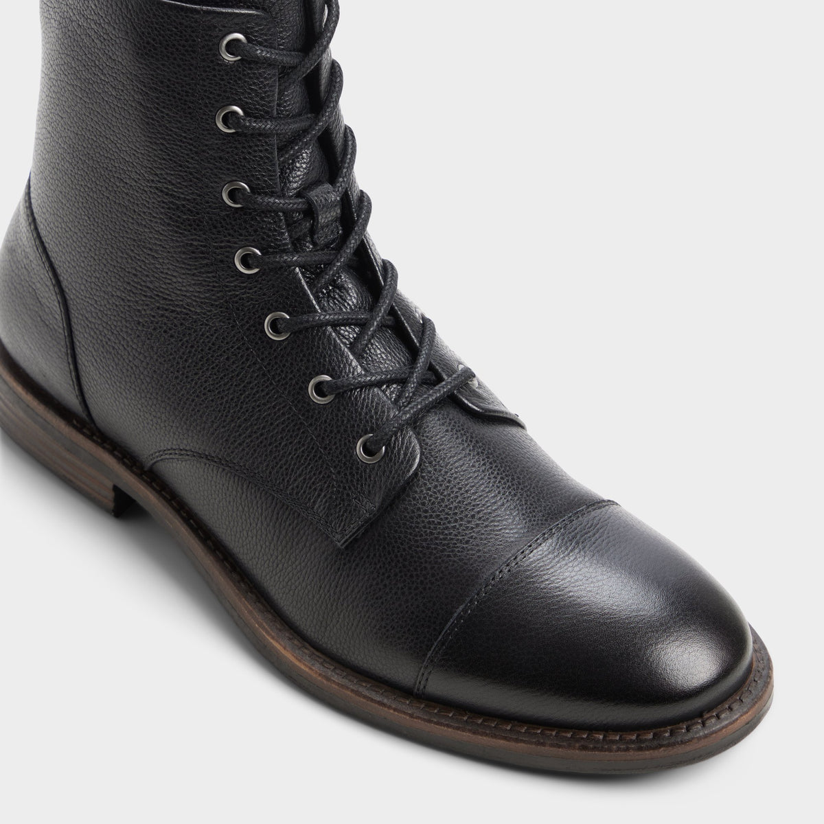 Three-quarter angle of Black Lazzar Lace-up boot's front side