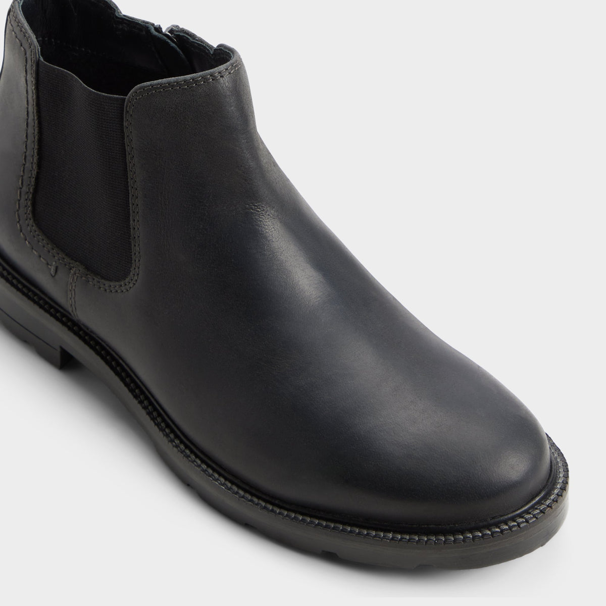 Three-quarter angle of Black Bryer Ankle boot's front side
