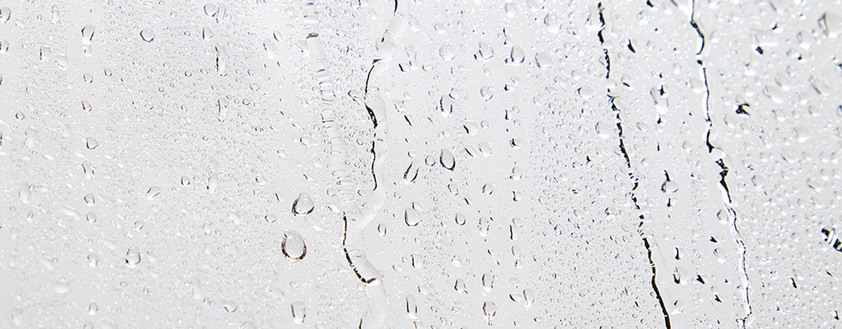 Close-up of a glass surface with water drops