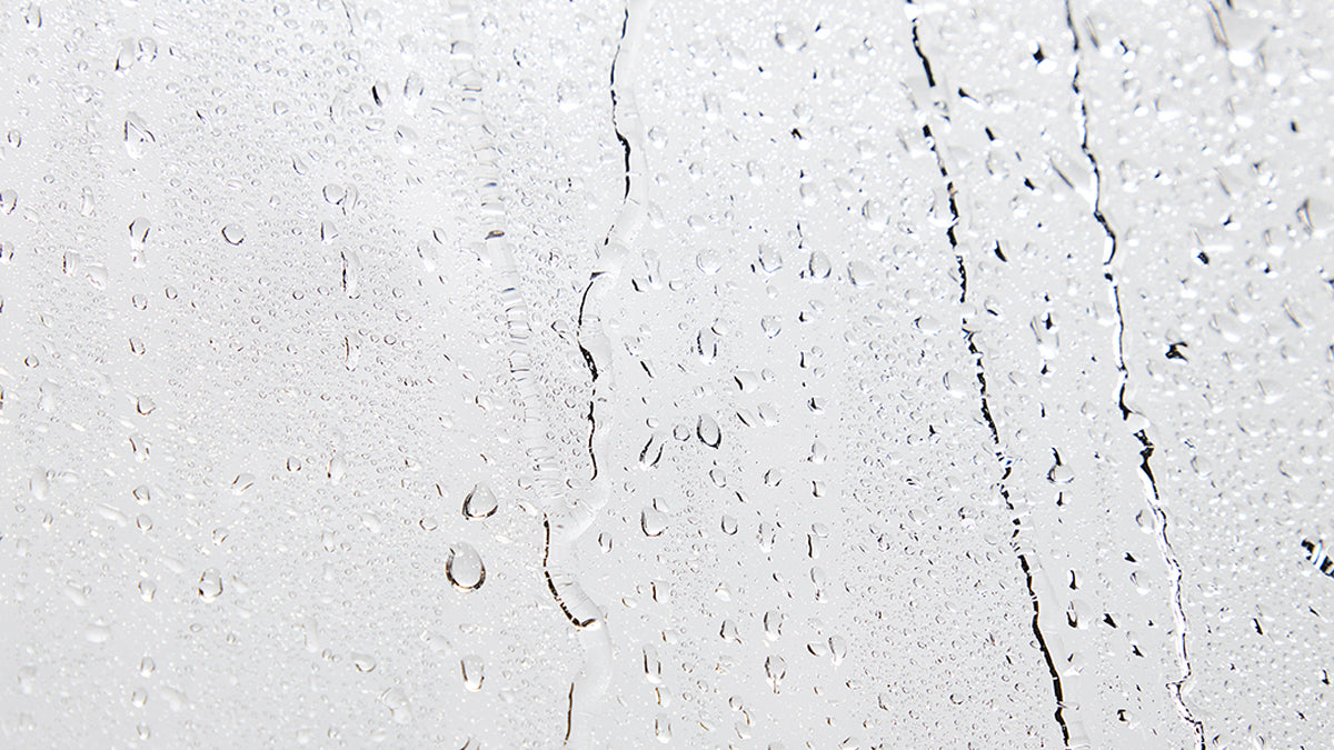 Close-up of a glass surface with water drops